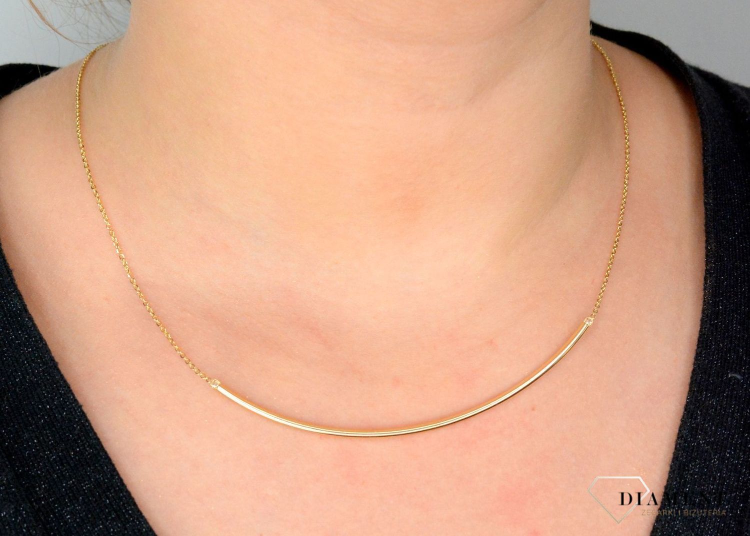 Złoty naszyjnik ze sztywną ozdobą zakończony cyrkonią NA 2971.jpg